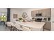 Modern kitchen with gray cabinets, stainless steel appliances, large island, and barstool seating at 13236 Stable Pl, Parrish, FL 34219