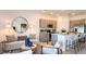 Open concept living room with modern furnishings, neutral tones, and stylish decor at 13236 Stable Pl, Parrish, FL 34219