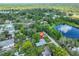 Overhead real estate shot of house near neighborhood pond and lush tree coverage at 1708 Pond Lake Dr, Tampa, FL 33612