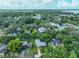 Real estate aerial view of neighborhood, highlighting the lush tree coverage at 1708 Pond Lake Dr, Tampa, FL 33612