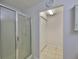Modern bathroom featuring a glass shower enclosure and ample storage at 1708 Pond Lake Dr, Tampa, FL 33612