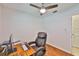 Cozy bedroom with ceiling fan and a nice working desk at 1708 Pond Lake Dr, Tampa, FL 33612