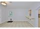 Bonus room showcasing tile floors, a bar, and a door to the backyard at 1708 Pond Lake Dr, Tampa, FL 33612