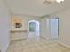 Bonus room showcasing an archway, tile floors, and seamless transitions to adjacent spaces at 1708 Pond Lake Dr, Tampa, FL 33612