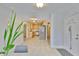 Inviting kitchen with stainless appliances and wooden cabinets flows into the dining area, bathed in natural light at 1708 Pond Lake Dr, Tampa, FL 33612