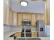 The kitchen has stainless steel appliances and light wood cabinetry at 1708 Pond Lake Dr, Tampa, FL 33612
