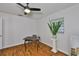 Bright office features dark wood floors, modern ceiling fan, and a vintage desk near a sunny window at 1708 Pond Lake Dr, Tampa, FL 33612