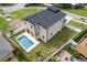 The property has a private pool, a covered patio, a fenced yard and landscaped surroundings at 1808 W Erna Dr, Tampa, FL 33603