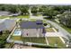 Beautiful home featuring a swimming pool, spacious yard, and paved driveway at 1808 W Erna Dr, Tampa, FL 33603