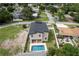 Home with a pool, landscaped yard, and a view of the surrounding neighborhood at 1808 W Erna Dr, Tampa, FL 33603