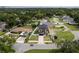 Aerial shot of modern home showcasing landscaping, driveway, and fenced perimeter at 1808 W Erna Dr, Tampa, FL 33603
