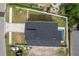 Bird's eye view of the property highlighting the roof, yard, and proximity to the street at 1808 W Erna Dr, Tampa, FL 33603