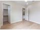 Bedroom featuring beautiful wood floors and a walk-in closet at 1808 W Erna Dr, Tampa, FL 33603