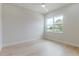 Bright bedroom with hardwood floors, large window, and modern ceiling fan at 1808 W Erna Dr, Tampa, FL 33603