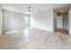 Spacious bedroom featuring hardwood flooring, a ceiling fan, and natural light from windows at 1808 W Erna Dr, Tampa, FL 33603