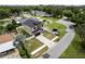 Aerial view of modern home with meticulously landscaped front yard and paved driveway at 1808 W Erna Dr, Tampa, FL 33603