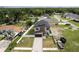 Aerial view of modern home with meticulously landscaped front yard and paved driveway at 1808 W Erna Dr, Tampa, FL 33603