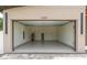 View of an open two car garage with epoxy flooring at 1808 W Erna Dr, Tampa, FL 33603