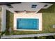 Overhead image of a private pool and backyard; a personal oasis for relaxation and recreation at 1808 W Erna Dr, Tampa, FL 33603