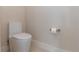 Close-up of white toilet and toilet paper holder at 1808 W Erna Dr, Tampa, FL 33603