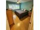 Bright bedroom featuring hardwood floors, a ceiling fan, and a view of the outdoors at 1975 W Bay Dr # 304, Largo, FL 33770
