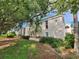 Exterior view of a multi-Gathering residence showcasing lush landscaping at 1975 W Bay Dr # 304, Largo, FL 33770
