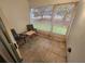 Cozy lanai with tile flooring and sliding screen doors leading to the outside at 1975 W Bay Dr # 304, Largo, FL 33770