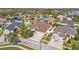 Aerial view of a home with a well manicured yard and a 3-car garage at 22623 Cliffside Way, Land O Lakes, FL 34639