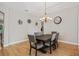 Dining room with tray ceiling and wood floors at 22623 Cliffside Way, Land O Lakes, FL 34639