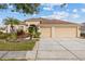 Beautiful single-Gathering home with a well-maintained lawn, mature landscaping, and a two-car garage at 22623 Cliffside Way, Land O Lakes, FL 34639