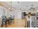 Open kitchen and breakfast nook with wood floors, stainless steel appliances and lots of light at 22623 Cliffside Way, Land O Lakes, FL 34639