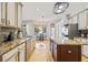 Bright kitchen features granite countertops, stainless appliances, and an island, perfect for cooking at 22623 Cliffside Way, Land O Lakes, FL 34639