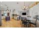 Open-concept kitchen with modern appliances, granite countertops, and a cozy dining area perfect for entertaining at 22623 Cliffside Way, Land O Lakes, FL 34639