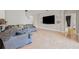 Living room with tile floors and gray sofas at 22623 Cliffside Way, Land O Lakes, FL 34639