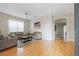 Living room with wood floors, gray sofas, and an open floor plan at 22623 Cliffside Way, Land O Lakes, FL 34639
