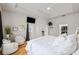 Spacious main bedroom featuring a tray ceiling, ample lighting and access to the balcony at 22623 Cliffside Way, Land O Lakes, FL 34639