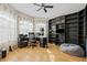 Well-lit office with hardwood floors, a large desk and ample storage space at 22623 Cliffside Way, Land O Lakes, FL 34639