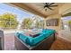 Outdoor patio with comfortable seating and a view of the pool and lush greenery at 22623 Cliffside Way, Land O Lakes, FL 34639