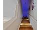 Elegant stairway featuring hardwood steps and accent lighting at 22623 Cliffside Way, Land O Lakes, FL 34639