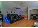 Home theater with comfortable seating, projector screen, and custom lighting at 22623 Cliffside Way, Land O Lakes, FL 34639
