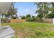 Large backyard featuring a new fence and mature trees at 2311 16Th S Ave, St Petersburg, FL 33712