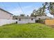 Exterior of a home with a spacious backyard, ideal for entertainment and relaxation at 2311 16Th S Ave, St Petersburg, FL 33712
