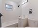 Modern bathroom featuring a shower/tub combo, new vanity and lighting at 2311 16Th S Ave, St Petersburg, FL 33712