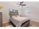 Bright bedroom with windows, fan, and wood-look floors at 2311 16Th S Ave, St Petersburg, FL 33712
