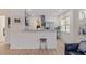 Modern kitchen featuring stainless steel appliances, gray cabinets, and a stylish breakfast bar at 2311 16Th S Ave, St Petersburg, FL 33712