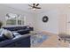 Stylish living room featuring luxury vinyl flooring, comfortable blue seating, and modern decor at 2311 16Th S Ave, St Petersburg, FL 33712