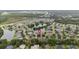 This aerial view shows the home's prime location near a lake and green spaces at 3725 Grand Forks Dr, Land O Lakes, FL 34639