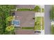 Aerial view showing the layout of the home and the screened in pool area at 3725 Grand Forks Dr, Land O Lakes, FL 34639