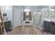 This bright bathroom features a separate shower and tub, dual vanity and wood look floors at 3725 Grand Forks Dr, Land O Lakes, FL 34639
