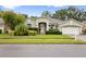 Charming single-story home with well-maintained landscaping and attached two-car garage at 3725 Grand Forks Dr, Land O Lakes, FL 34639